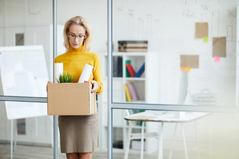 Employee leaving job with box of items
