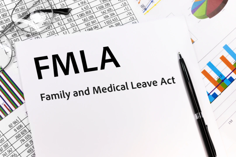 FMLA document with pen and charts and graphs