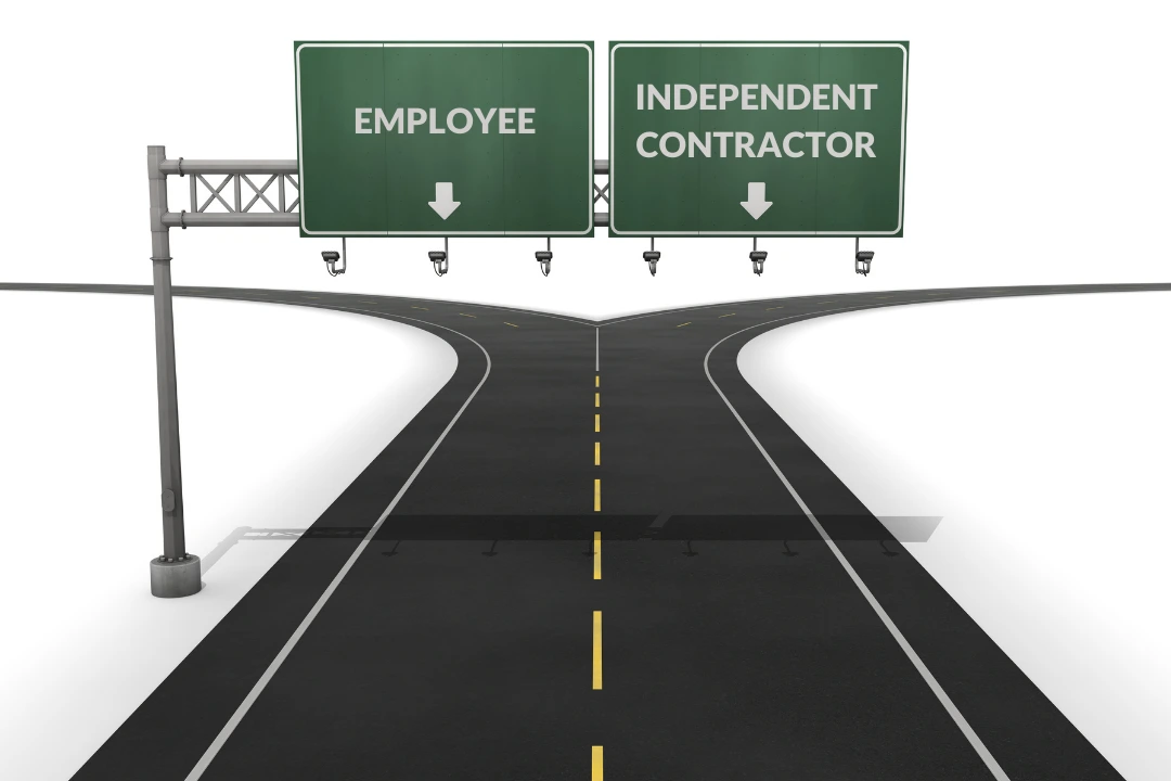 highway with two signs one on right for independent contractor one on left for Employee to represent new DOL final rule on employee classification