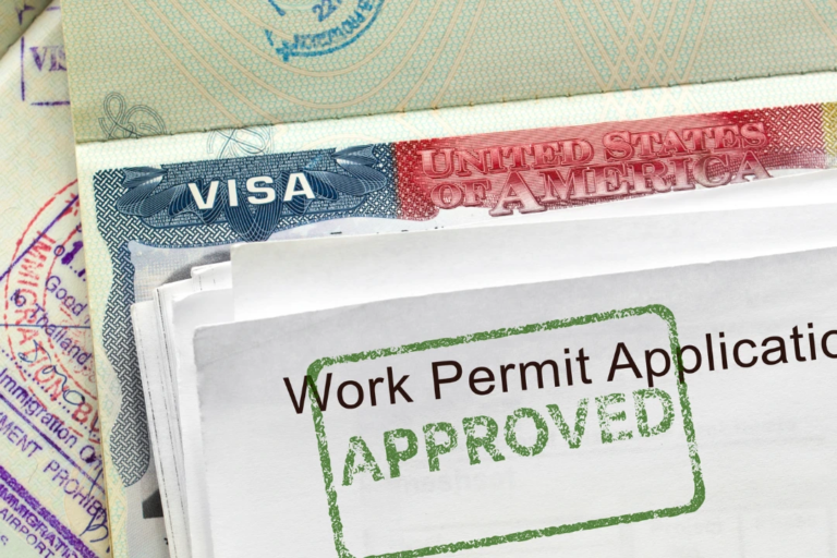Work permit application approved with U.S. visa documents, representing changes to work permit extensions and employment authorization policies.