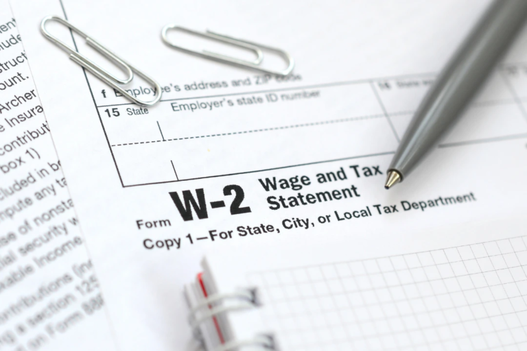 W-2 tax form close-up related to upcoming payroll reporting changes